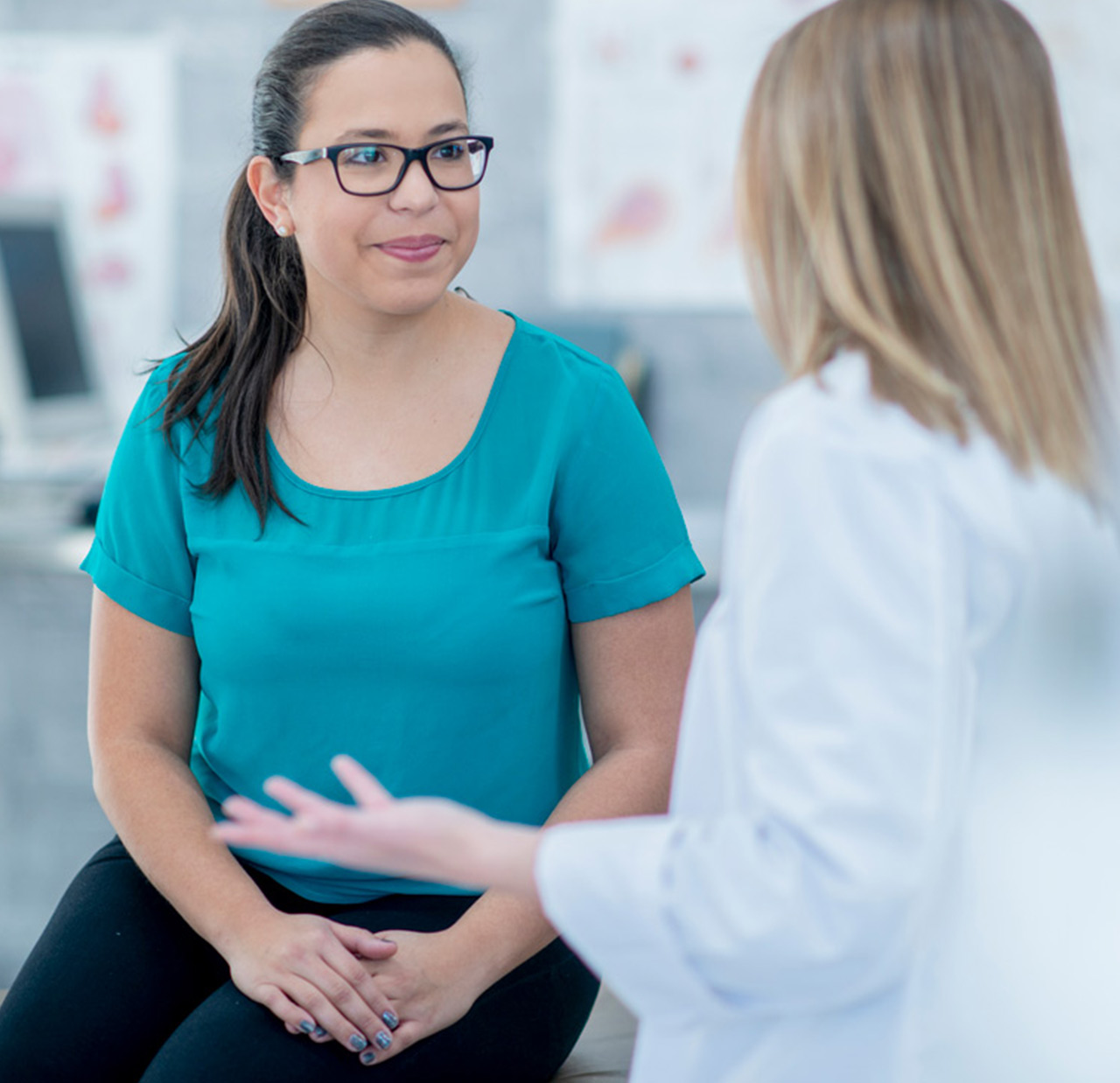 woman speaking to doctor