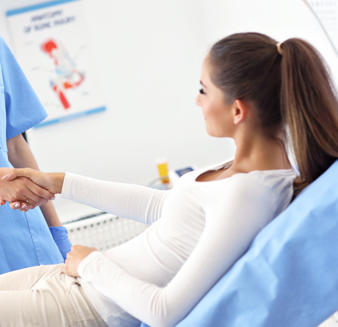 Adult woman having a visit at female doctor's office Adult woman having a visit at female doctor's office